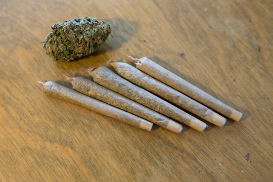 Marijuana or Cannabis bud dried flower and joints arranged