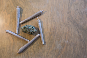 Marijuana or Cannabis bud dried flower and joints arranged