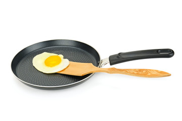 fried eggs in a pan isolated on white background