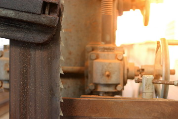 Close up blade of bandsaw. Sunshine effect