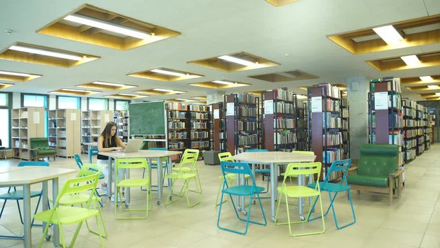 two students learn in the library
