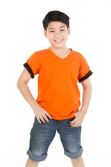 Photo of adorable young happy asian boy looking at camera