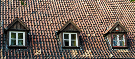 old roof with attic windows
