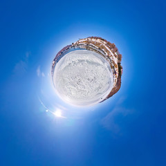 The snow on the ice lake baikal at the pier from which the ship