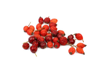 Heap of rosehips isolated on white background