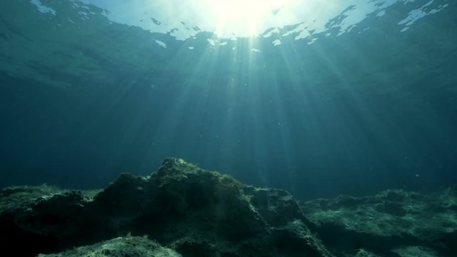 Beautiful sun rays filmed underwater.
