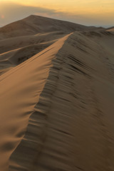 Fototapeta na wymiar Sunset over the Gobi desert, dune Hongoryn, Mongolia