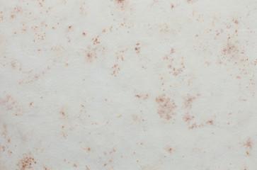 Old paper with flower pattern overlay.