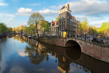 Obraz premium Dutch scenery with canal and mirror reflections, Amstardam, Netherlands, toned
