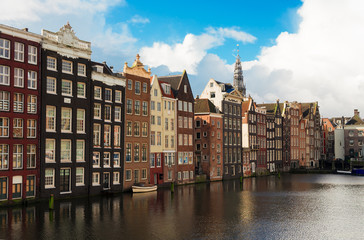 Fototapeta na wymiar Typical dutch houses over canal, Amstardam, Netherlands