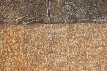Fototapeta premium Historical wall of sandstone. Details of sand stone texture 