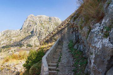 Fototapeta na wymiar Illusion of dead-end road on the way to the fortress of St.John. Kotor, Montenegro