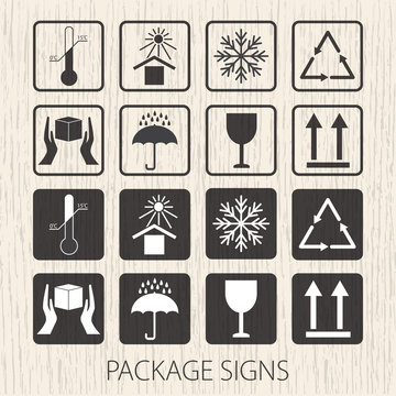 Vector packaging symbols on vector wooden background. Icon set including fragile, this side up, handle with care, keep dry and other caution handling symbols. Stock vector. Flat design.
