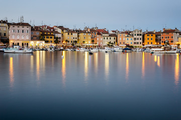Embankment historic part of Rovinj, Croatia. The lights reflected in the water