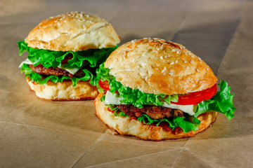 Fresh hamburgers on craft paper