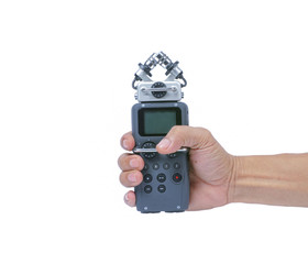 hand hold audio recorder. isolated on white background