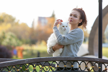 young lady with Maine Coon cat