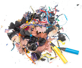 shavings of colored pencils on white background