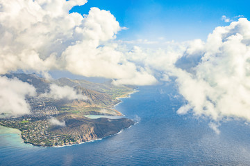 Amazing aerial island view among the clouds on the horizon in the middle of the Pacific ocean....