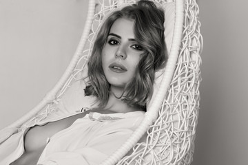 Beautiful sexy girl, blond, interior studio, white background