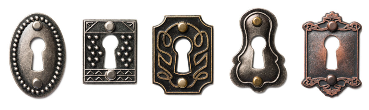 Five patined bronze and brass decorative antique keyholes Isolated on White Background