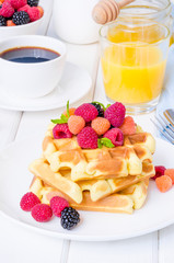 Belgian waffles with raspberries and blackberries for breakfast
