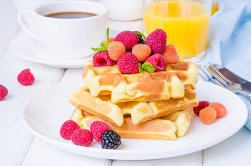 Belgian waffles with raspberries and blackberries for breakfast