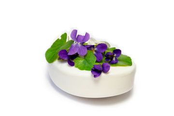 Fototapeta na wymiar Soap and flowers viola