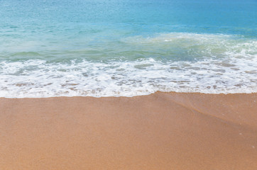 white soft wave on empty tropical beach and blue sea 