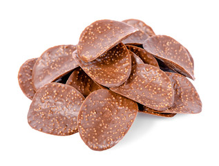 pile of dark chocolate chips is isolated on white background, cl