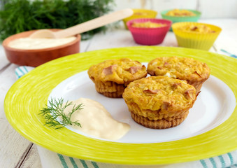 Muffins from cabbage with ham and cheese. Sour cream sauce.