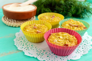 Muffins from cabbage with ham and cheese. Sour cream sauce.