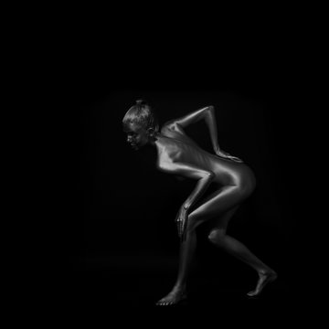 naked body in a silver body painting