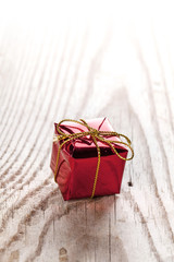 Gift box on wooden background