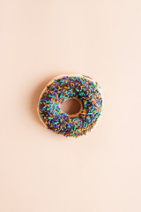 chocolate donut with colorful sprinkles sugar
