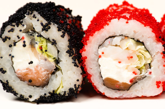 two delicious sushi rolls isolated on white