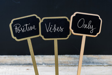 Motivational message Positive Vibes Only written with chalk