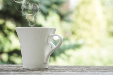 white coffee cup on a wooden table