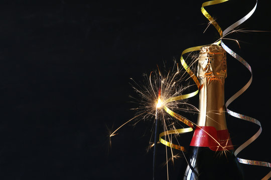 Abstract image of champagne bottle and festive lights