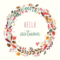 Autumn wreath with leaves, plants and decorative branches © lilett