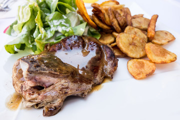 juicy steak beef meat with tomato and potatoes