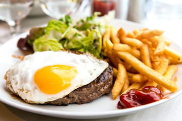 Egg and fries - classical english breakfast with egg and fries