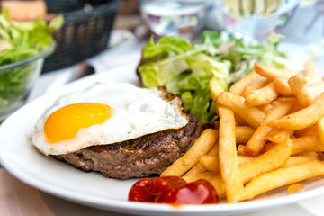 Egg and fries - classical english breakfast with egg and fries