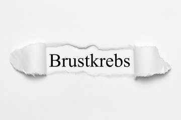 Obraz premium Brustkrebs auf weißen gerissenen Papier