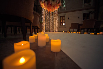 Candles and decorations with lights in the wedding hall