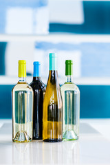 Four Wine Bottles on Bar