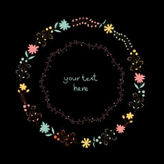 Floral wreath isolated on dark background