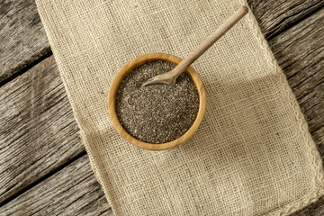 Top view of wooden bowl full of chia seeds