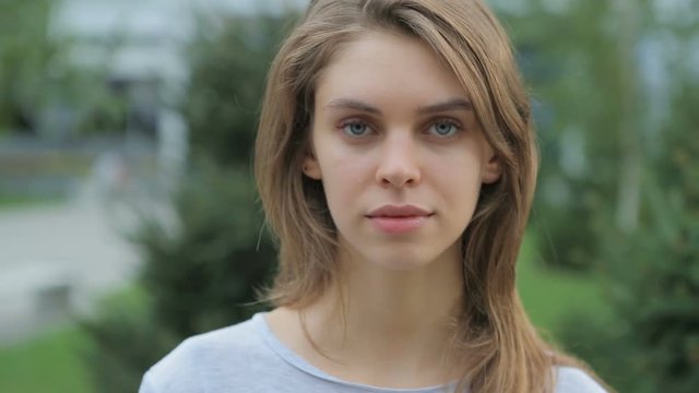 Portrait of a young , beautiful , sad girl