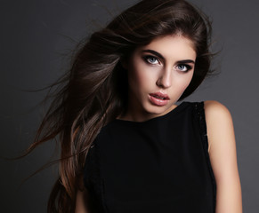 Obraz premium beautiful girl with dark hair and bright makeup in elegant dress